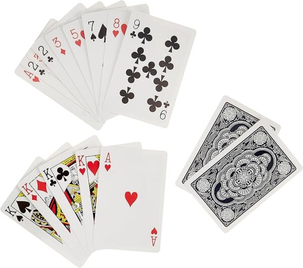 Assorted playing cards from the Tenyo New Card Magic set showing kings, aces, and other face cards.